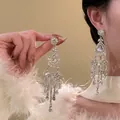 Exquisite sparkling zircon flower chandelier earrings with long tassels detail shot. - 15# Silver Pin - Silver