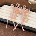 Elegantes pendientes de lazo de cuentas de cristal rosa con borlas largas colgantes - 54# Estilo de Borla de Lazo de Cristal Rosa / Rosa