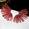 Macro view of sparkling red zircon fan-shaped earrings featuring a high-end luxury design - 47# Steel Needle - Gold Red