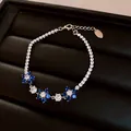 Elegante bracciale con fiori in zirconia blu e bianchi su una classica catena tennis argento - Bracciale Zirconia Quadrifoglio Blu e Bianco (35#) / Argento-Blu