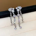Exquisite silver-tone earrings detailed with sparkling cubic zirconia and white pearls. - Silver