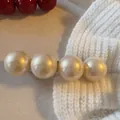 Macro view showing the glossy texture of a four-pearl hair clip on a soft white knit - 36# Pearl Spring Clip (Single Piece) / Silver