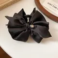 Elegant black satin bow hair claw clip featuring a sparkling rhinestone center detail. - 65# Hair Claw (Single) / Black