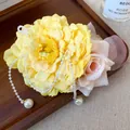 Elegant yellow and pink fabric flower hair clip with long pearl tassels on a tray - Alligator Clip - Yellow Pink