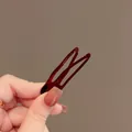 Elegant burgundy glossy snap hair clip held by hand for hair styling demonstration. - 76# Duckbill Clip (Single) / Red