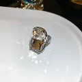 Vintage palace style ring with large cushion-cut clear gemstone and silver textured band - Silver