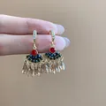 Elegant fan-shaped tassel earrings with crystal drops and vibrant gemstones for women. - 85# Fan-Shaped Tassel Crystal Earring Hook Style / Red Blue and Brown Mixed