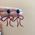 Elegant burgundy bow-knot stud earrings with a black bead accent for a stylish look - 103# Matte Bow-tie Silver Earring Post Style / Burgundy