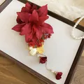 Close-up of elegant red lily fabric hair clip with golden butterfly and pearl tassels - Duckbill Clip (24#) / Gold-Red