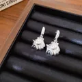 Macro di orecchini pendenti in argento con stella marina e conchiglia - Conchiglie E Stelle Marine / Argento