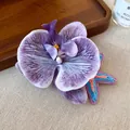 Detail of purple fabric orchid and colorful woven starfish hair clips on a linen surface - Alligator Clip - Purple