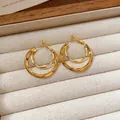 Elegant minimalist double-layered gold hoop earrings presented in a luxury jewelry tray - Double Concentric Ring Style (135#) / Gold