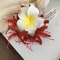 Detailed close-up showing the plumeria and red floral design of this elegant hair clip - Duck Clip-Red
