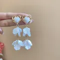 Elegant silver needle flower tassel earrings with heart shaped design in white and gold finish - Heart-Shaped Petal Tassel Style (90# Silver Earring Post) / White