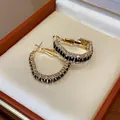 Elegant gold-plated geometric hoop earrings with black and white zircon stones detail - Geometric Hoop (Gold/Black Zirconia)