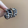 Fashionable braided hoop earrings with animal print pattern in beige and black colors. - Silver Earring Post-Woven Hoop Style (132#) / Gold-Light Coffee