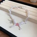 Élégant bracelet en perles baroques vintage avec détail de nœud en perle rose chic - Style Nœud Papillon Perle / Blanc/Rose