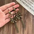 Vintage style bronze tassel earrings featuring geometric triangles and ethnic green beads - 118# Geometric Tassel Style (HE11080) / Hook Style / Gold Brown