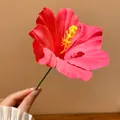 Close-up view of a vibrant pink fabric hibiscus flower hair stick accessory for women - Hair Stick Pink-Five Petal Flower / Pink