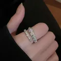 Close-up view of an elegant silver-toned open ring with sparkling cubic zirconia stones - Snake Style (5253222784061) / Silver