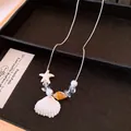 Elegante böhmische Sommerhalskette mit natürlichen Muscheln und Seestern-Anhänger - Silberkette Seestern
