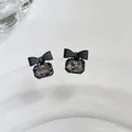 Elegant silver needle stud earrings with matte black bow and grey faceted crystal gem - Black Bowknot Style (Silver Post)