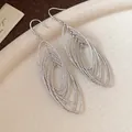 Elegant silver marquise-shaped hollow drop earrings featuring shimmering zircon stone hooks - Silver