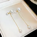 Elegant French vintage pearl tassel drop earrings featuring gold-tone chains for women - White Pearl Tassel