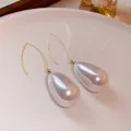 Elegant gold hooks with large pearlescent white water drop pearl earrings for women - Ear Hook Style 1
