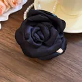 Elegante molletta per capelli a forma di rosa in tessuto satinato nero per donna - nero classico
