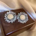 Transparent sunflower-shaped irregular ice crystal earrings with gold glitter center - Gold Core Sunflower Ice Style / Clear