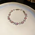 Exquisito primer plano de una pulsera de circonita con piedras hexagonales rosas y flores - Estilo 68# Plateado Rosa Cierre