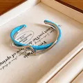 Brazalete abierto de doble capa ondulada con acrílico turquesa y acabado plateado - Plata-Azul