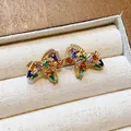 Detailed view of 18K gold-plated pony stud earrings set with colorful zircons - Silver Post Pony Style / Gold-Multicolor