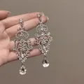Luxurious silver needle rhinestone floral teardrop tassel earrings in silver finish - European Retro Pattern Hollow Tassel Style (46#)