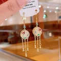 Elegant ethnic style gold tassel earrings with intricate flower motif on white inlay - 15# Ear Hook (925 Sterling Silver Post)