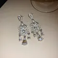 Elegant silver-toned earrings featuring crystal flower and sparkling teardrop tassel details - Flower Element Three-Way Tassel Pendant Style (49#)