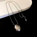Minimalist polished silver oval pendant necklace on a sleek titanium steel chain - Oval Pendant Style / Silver