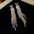 Elegant long tassel earrings with sparkling rhinestones and X-shaped crystal top - Cross X-Shaped Zirconia Dense Tassel Style (61#)