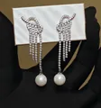 Elegant silver-tone tassel earrings featuring sparkling rhinestones and white pearls - Knot Shaped Full Rhinestone Long Pearl Tassel Style (76#)