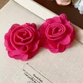 Macro view of elegant red chiffon rose flower earrings placed on a textured gift box - Flower Stud Earrings / Rose Red