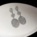 Elegant silver-toned drop earrings featuring pearl flower clusters and sparkling rhinestones - Three-Stage Flower Cluster Pearl Full Rhinestone Tassel Style (78#)