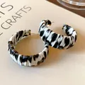 Minimalist hoop earrings featuring a black and white zebra pattern with a fabric wrap finish. - Animal Stripe Hoop (37#)