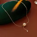 Elegant gold titanium steel necklace featuring a zircon encrusted hulu gourd tassel pendant - Style 30