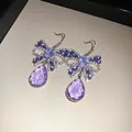 Elegante paarse zirkoon vlinder oorbellen met zilveren naalden en druppel. - Oorbelhaakjes / Holle strik paars waterdruppel stijl (69#)