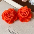 Elegant vibrant orange chiffon flower stud earrings featuring a layered rose design. - Flower Stud Earrings / Orange