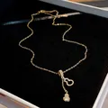 Elegant gold titanium steel gourd tassel pendant necklace with shimmering zircon stones - Style 1