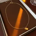 Elegant gold titanium steel necklace featuring a polished Wu Lou gourd pendant design - Style 25