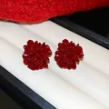 Detail view of elegant red enamel flower stud earrings displayed in a white jewelry box - 29# (Enamel Flower-Silver Post) / Red