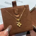 High-quality gold-plated necklace featuring a textured flower pendant and zircon charm - Necklace - Gold